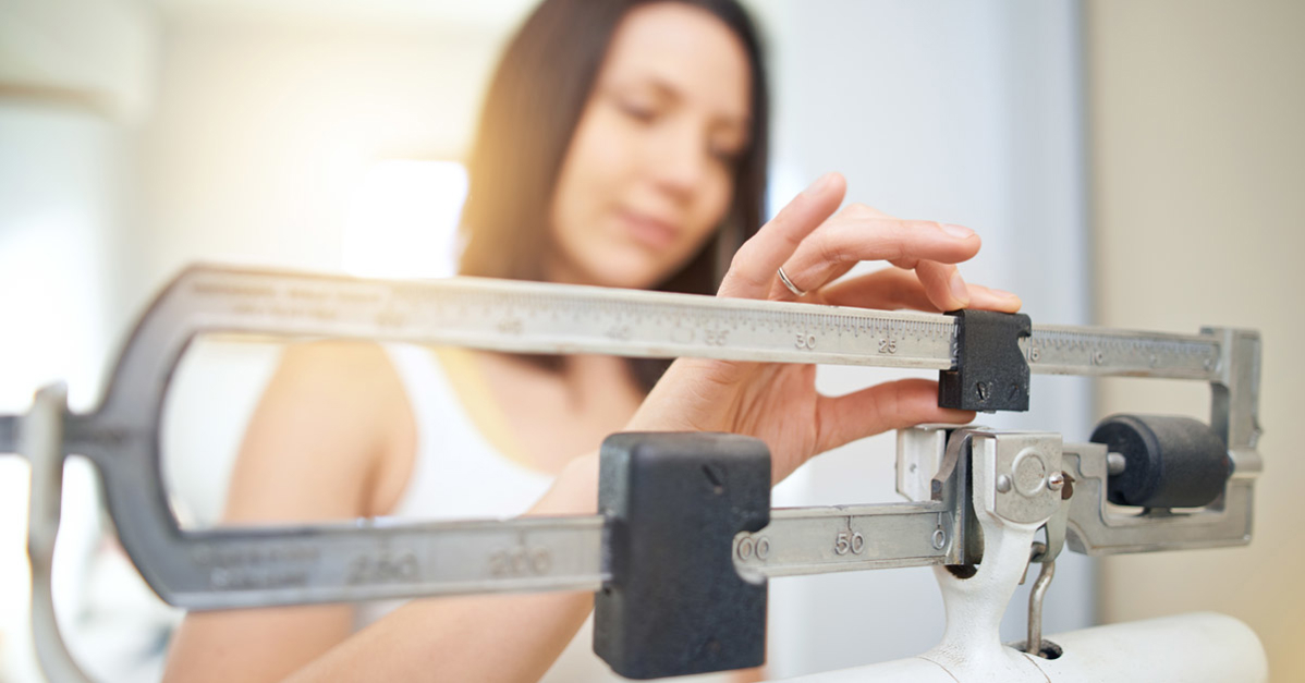 Woman using scale