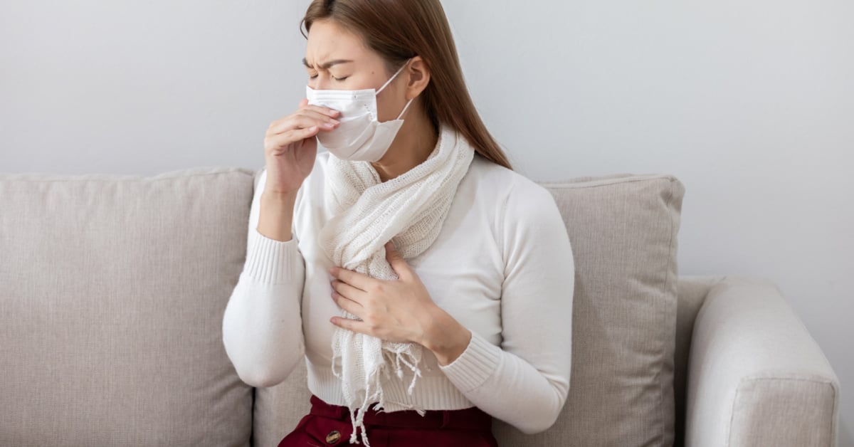 a sick female with a face mask