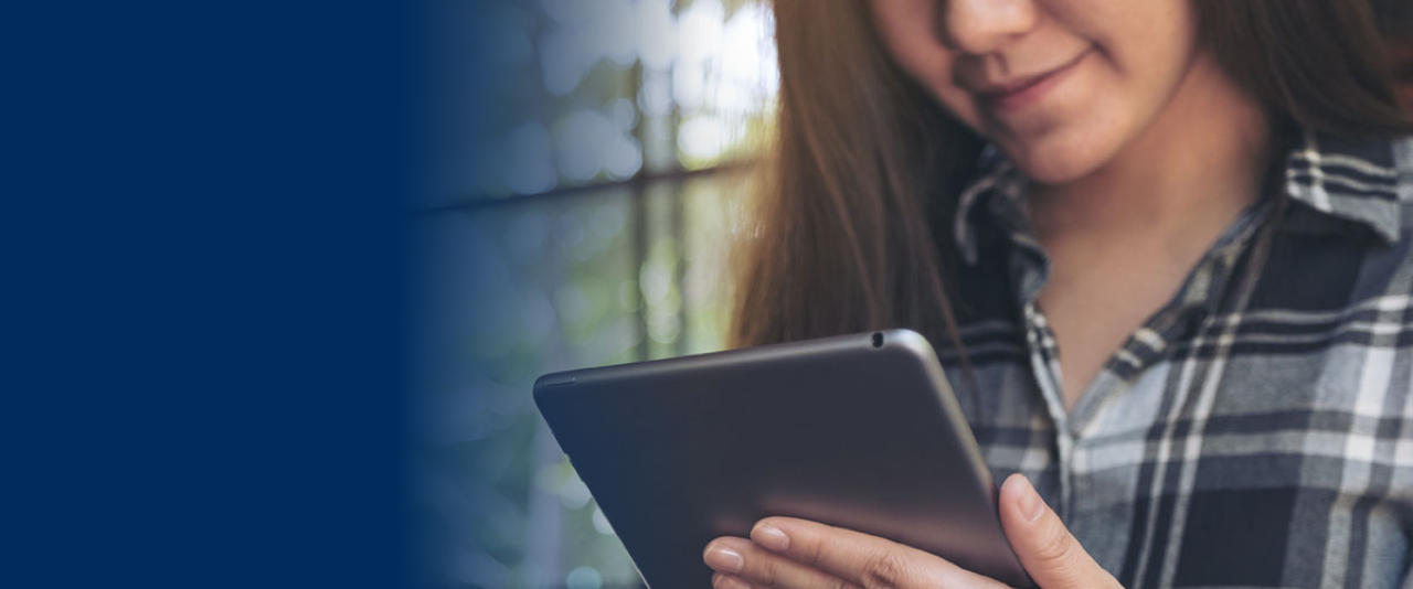 woman holding her tablet